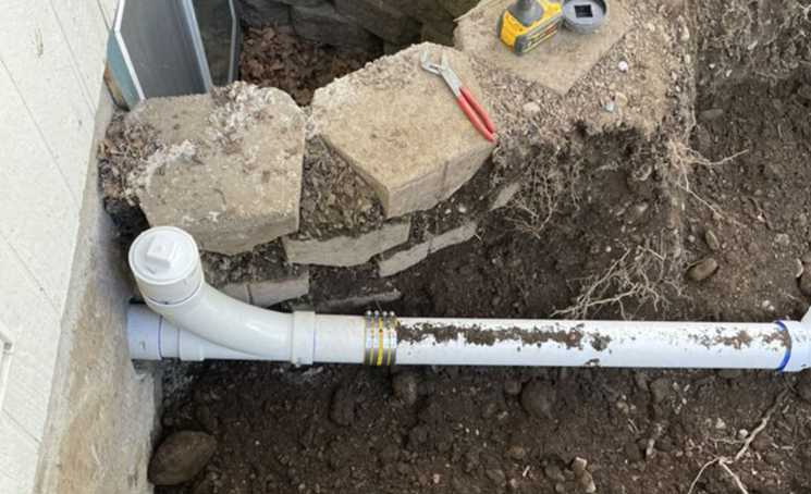 Sewer line replacement in an open trench